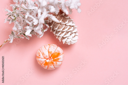 Top view Christmas and New Year decorations, pine cone, mandarin on a pink background. Flat lay Handmade New Year soap. Xmas toys. Holiday concept, gifts and homemade soap
