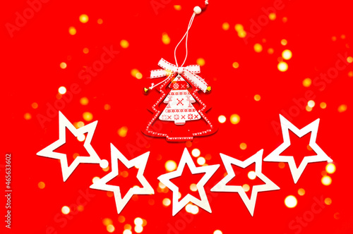 Christmas tree toy of fir tree on red background. Christmas greeting card with place for your text.