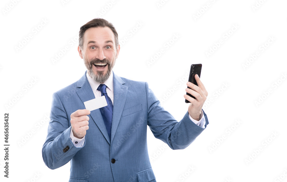 happy mature office manager in suit hold debit card and smartphone isolated on white, internet buy happy mature office manager in suit hold debit card and smartphone isolated on white, internet buy