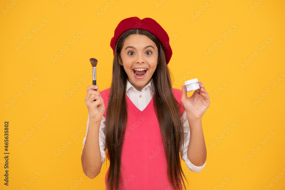 tween and youth. facial care. happy french teen girl hold powder brush. childhood happiness tween and youth. facial care. happy french teen girl hold powder brush. childhood happiness