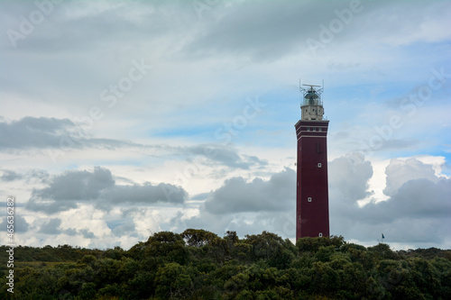 Westhoofd lighthouse on the right, in Ouddorp in the Netherlands, in a green landscape