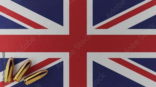 Three 9mm bullets in the bottom left corner on top of the national flag of United Kingdom