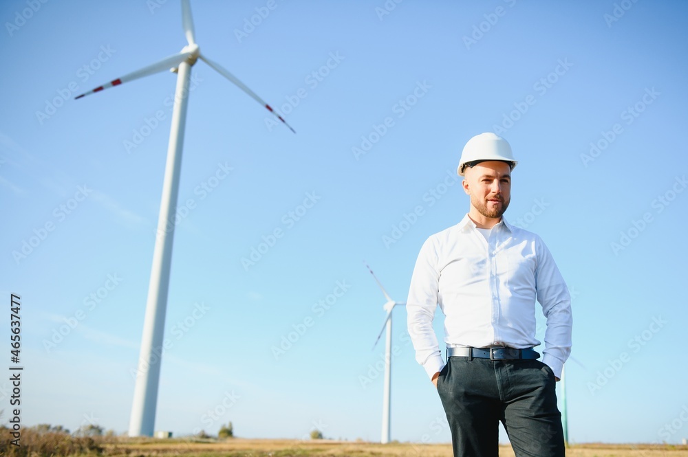 Businessmen engineering standing handsome smile front of turbine looking away Businessmen engineering standing handsome smile front of turbine looking away