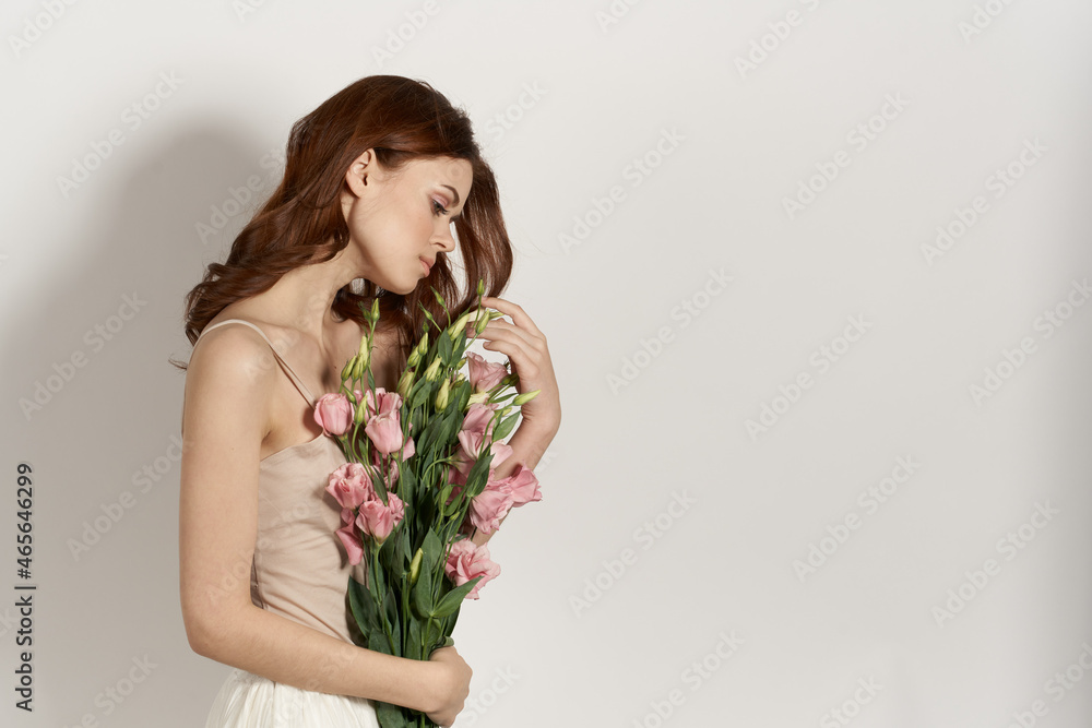 cheerful woman with a bouquet of flowers lifestyle glamor cheerful woman with a bouquet of flowers lifestyle glamor