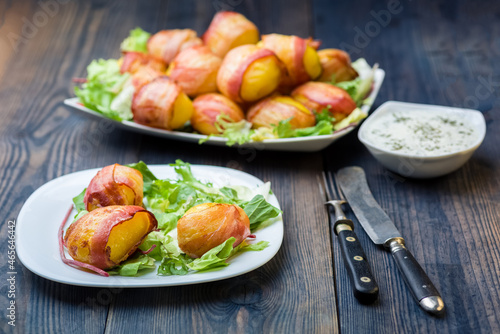 baked potatoes wrapped in bacon