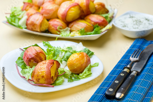 baked potatoes wrapped in bacon