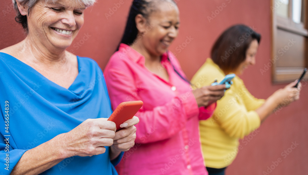 Senior happy people using mobile phones outdoor - Elderly lifestyle technology concept