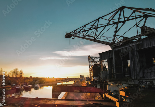 Sunset over city canal in urban industrial area Sweden Gävle.