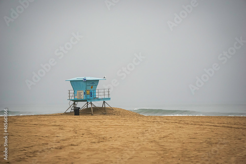 Lifeguard tower and beach on foggy morning