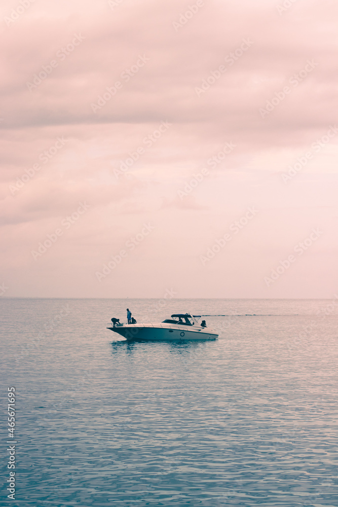 Fototapeta premium Yacht on the Caribbean Sea during sunset in Jamaica.