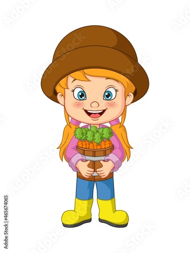 Cute little girl harvesting carrots