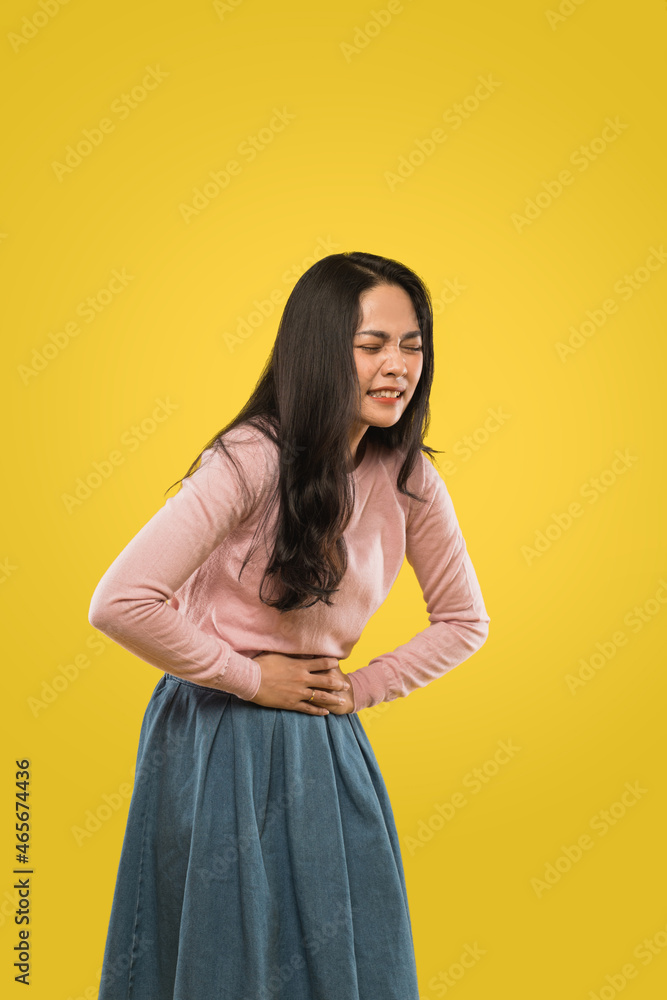 woman sore expression both hands stomach and bending over during menstruation woman sore expression both hands stomach and bending over during menstruation