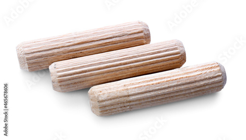 Wooden dowel pins on white background photo
