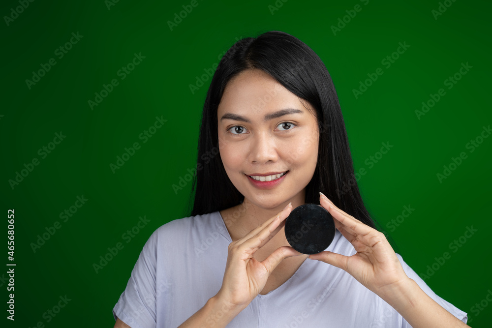 beautiful woman holding cosmetic cream cap after make up beautiful woman holding cosmetic cream cap after make up