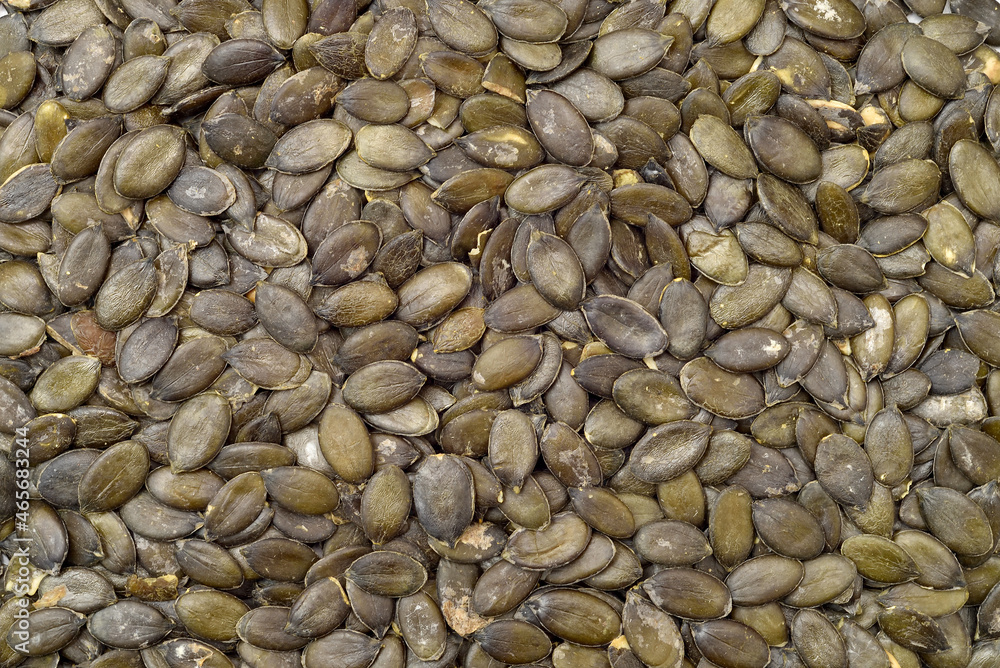 Macro shot of pumpkin seeds. Top view. Healthy food concept. Macro shot of pumpkin seeds. Top view. Healthy food concept.