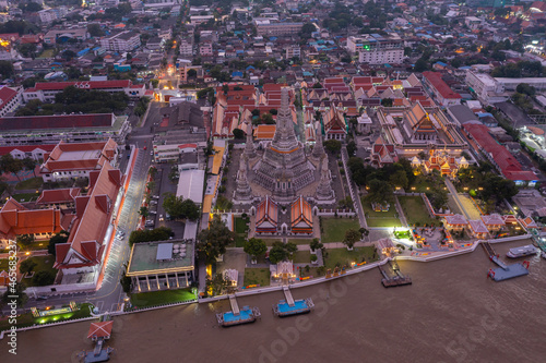 Aerial view Day to Night of Chao Phraya River with Royal Grand Palace and Emerald Buddha Temple Landmark of Bangkok  Thailand. Amazing Drone Footage over the City skyline in twilight.