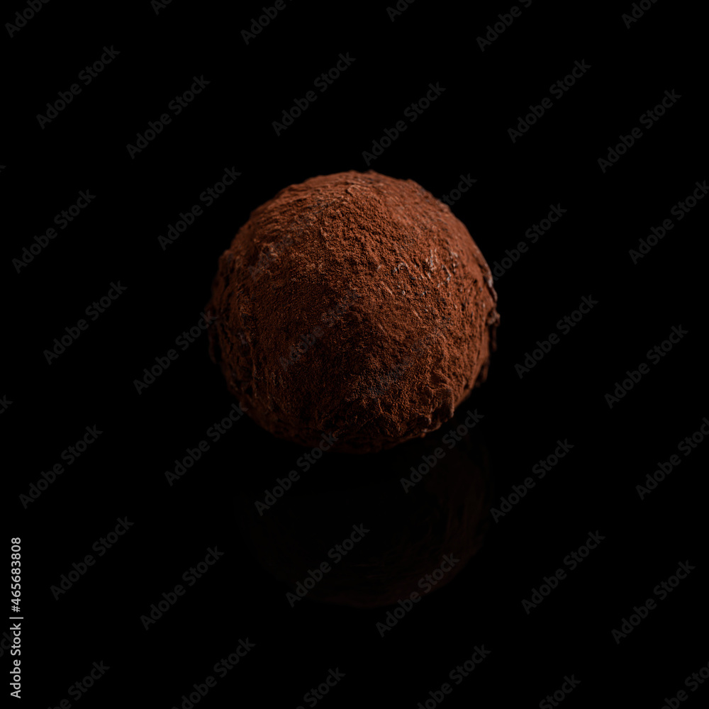Chocolate truffle isolated on a black background. Chocolate truffle isolated on a black background.