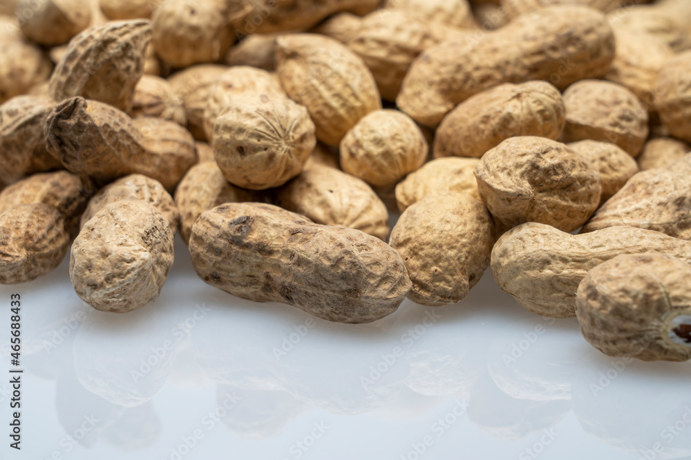 inshell peanuts close-up, organic peanuts, top view, selective focus. background image inshell peanuts close-up, organic peanuts, top view, selective focus. background image