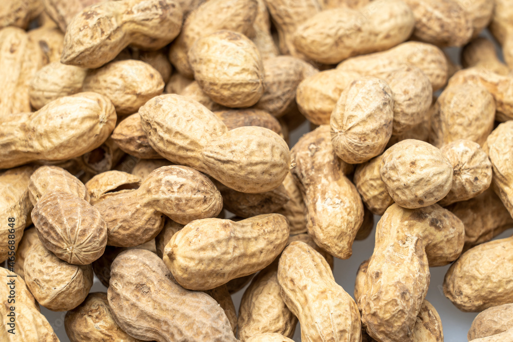 inshell peanuts close-up, organic peanuts, top view, selective focus. background image inshell peanuts close-up, organic peanuts, top view, selective focus. background image