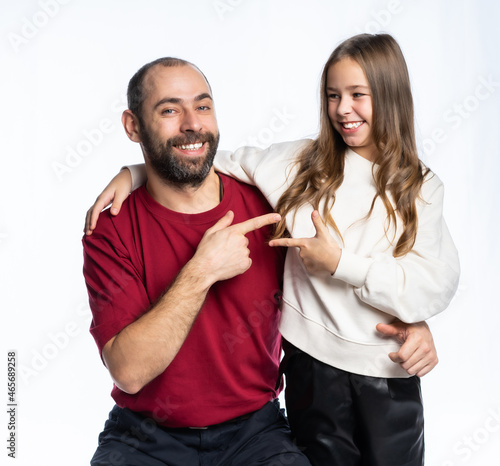 man smiling daughter pointing fingers at each other. isolated background