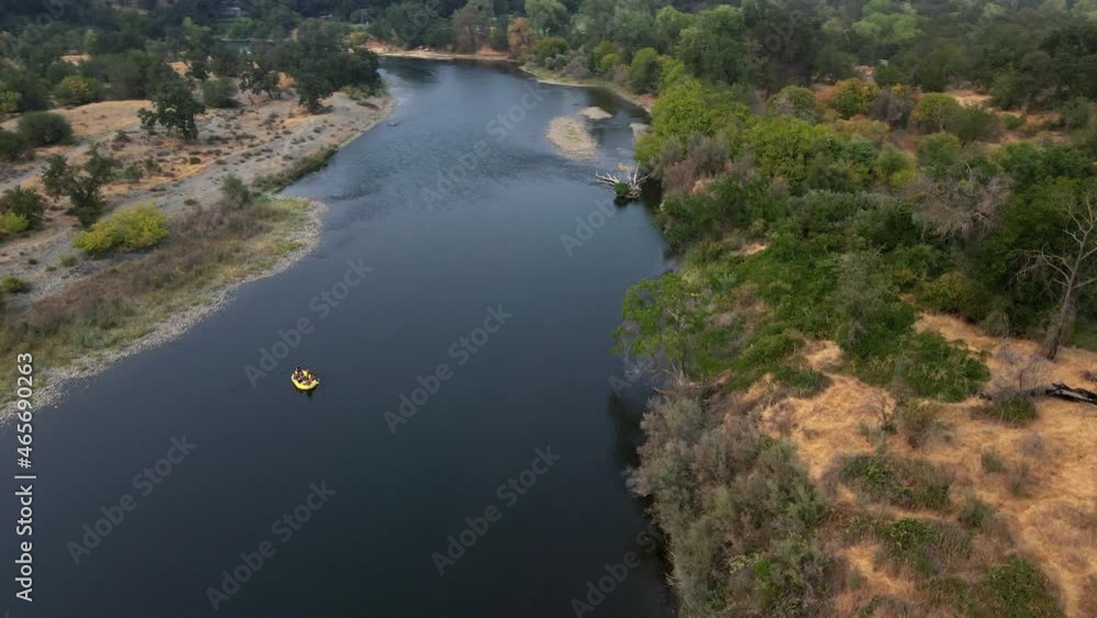 Tourist On Floating Boat Along The American River On Summer In Sacramento County, California USA. Aerial Orbiting Tourist On Floating Boat Along The American River On Summer In Sacramento County, California USA. Aerial Orbiting