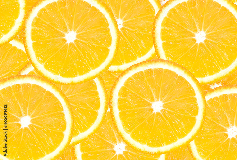 Orange sliced into rings, stacked on top of each other Orange sliced into rings, stacked on top of each other