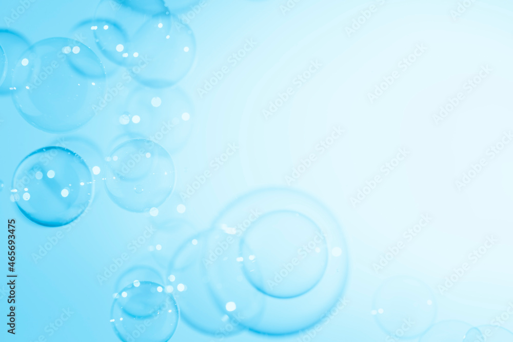 Beautiful Transparent Blue Soap Bubbles Background. White Copy Space