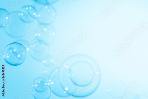Beautiful Transparent Blue Soap Bubbles Background. White Copy Space