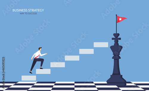 Business strategy for success, businessman climbing up stairs to the top of chess