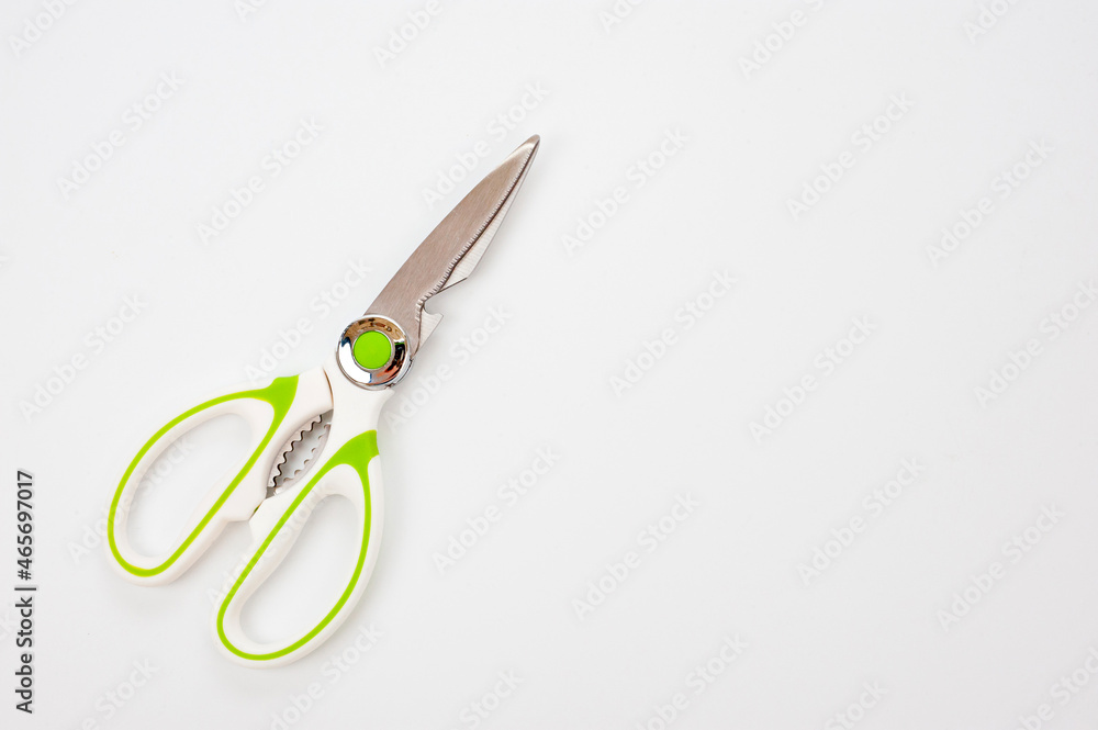 Metal scissors, universal with a white plastic handle with light green rubberized inserts. Metal scissors, universal with a white plastic handle with light green rubberized inserts.