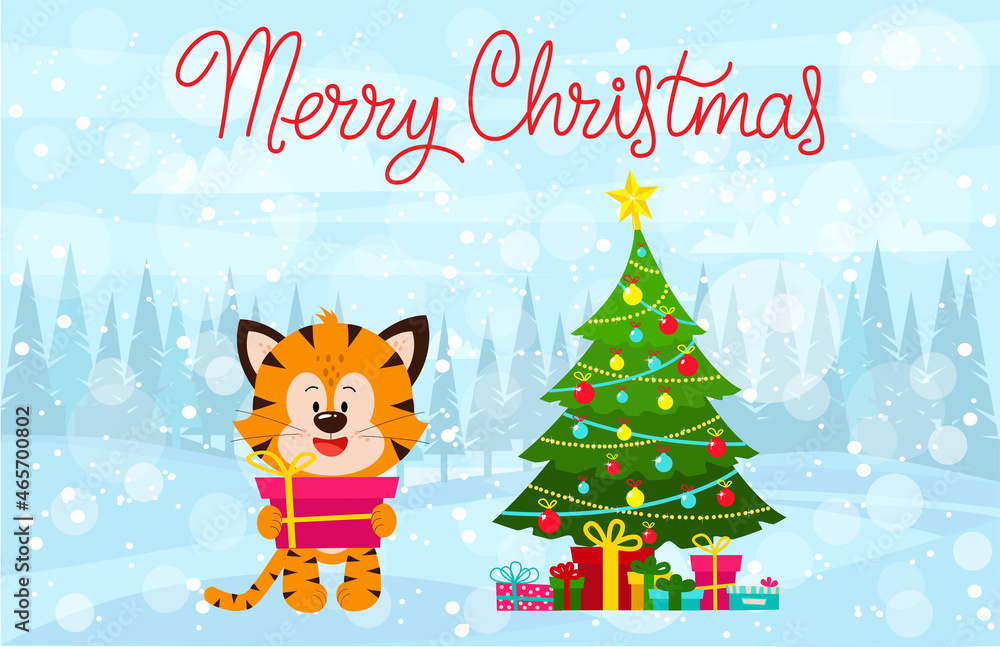 A tiger cub with a pink gift in its paws is standing in the forest. Christmas greeting with a tiger and a festive Christmas tree. 2022 is the year of the tiger.