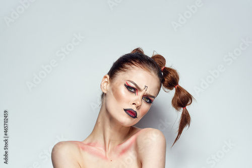 pretty woman posing scorpio sign on forehead cosmetics studio model