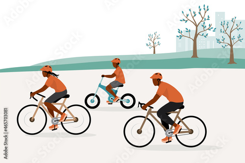 Black Family With One Child Riding Bicycle Together In The Park.