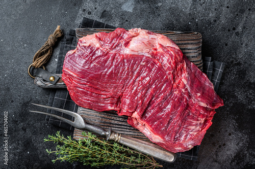 Leinwand Poster Uncooked Raw Flank or flap beef steak on butcher board