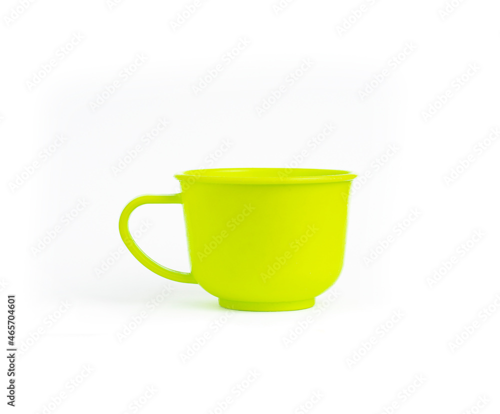 An image isolated a single ceramic teacup green color for drink on white background with clipping path. An image isolated a single ceramic teacup green color for drink on white background with clipping path.