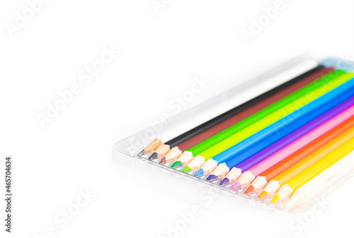 An image isolated select focus colour crayons art for draw drawing design on white background with copy space for text. © Scream