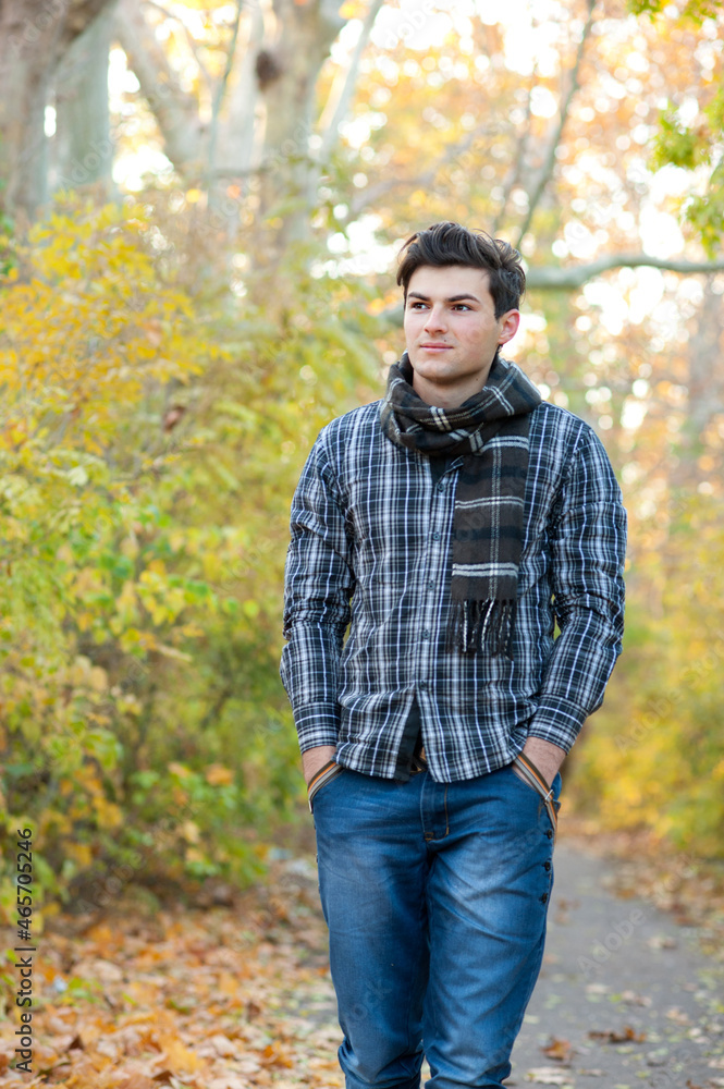 Young man have a rest in autumn park, outdoor Young man have a rest in autumn park, outdoor