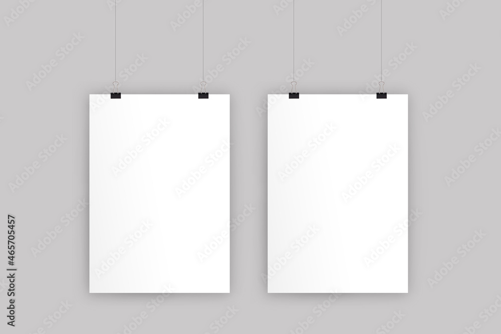 Hanging empty blank posters mockup isolated on a grey background. 3d rendering. Hanging empty blank posters mockup isolated on a grey background. 3d rendering.