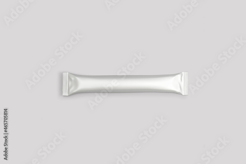 Empty blank White sachet stick mock up isolated on a grey background. Photo-realistic packaging mockup template. It can be used in the adv, promo, packadge, etc. 3d rendering.