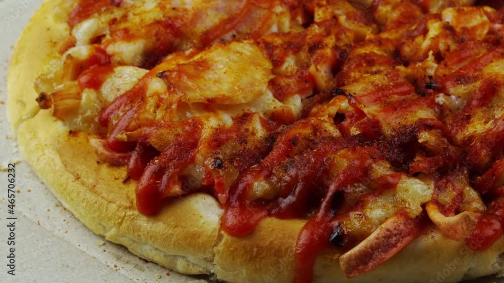 close up pizza rotating on a box close up pizza rotating on a box