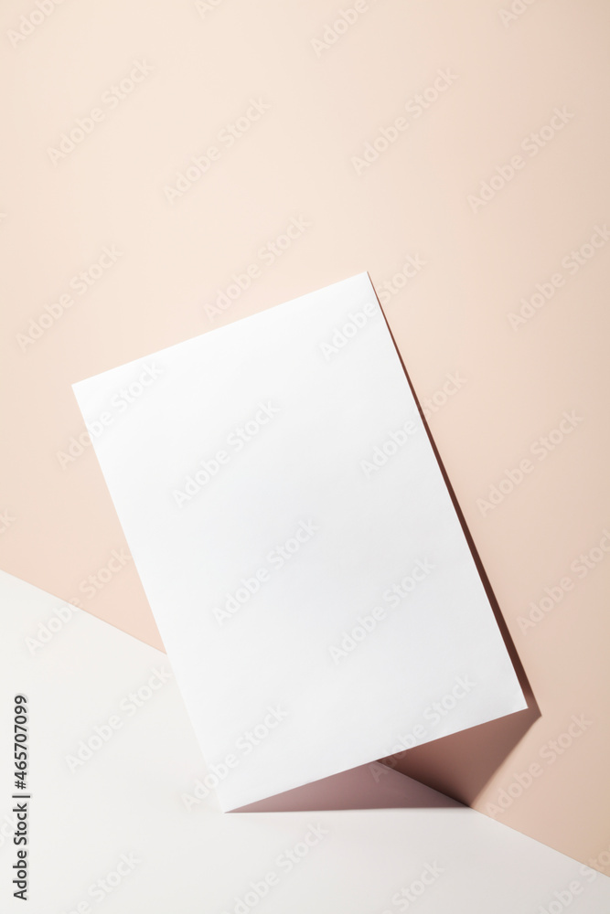 paper card note on beige background with shadow. paper card note on beige background with shadow.