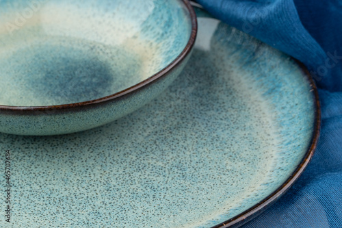 Fotografie Ceramic plate on a wooden table top view