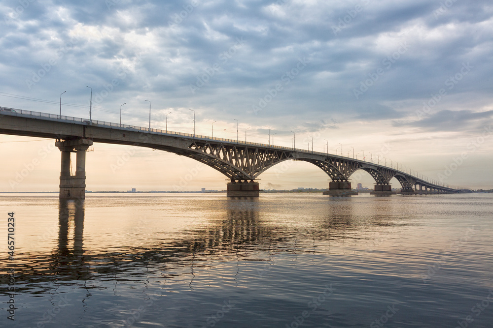 Bridge over the river Volga in sunset. The bridge connects Saratov and Engels. Russia Bridge over the river Volga in sunset. The bridge connects Saratov and Engels. Russia