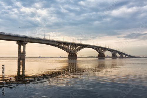 Fototapeta Naklejka Na Ścianę i Meble -  Bridge over the river Volga in sunset. The bridge connects Saratov and Engels. Russia