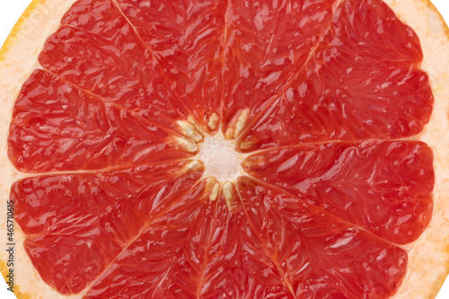 Halved red grapefruit close up on white background
