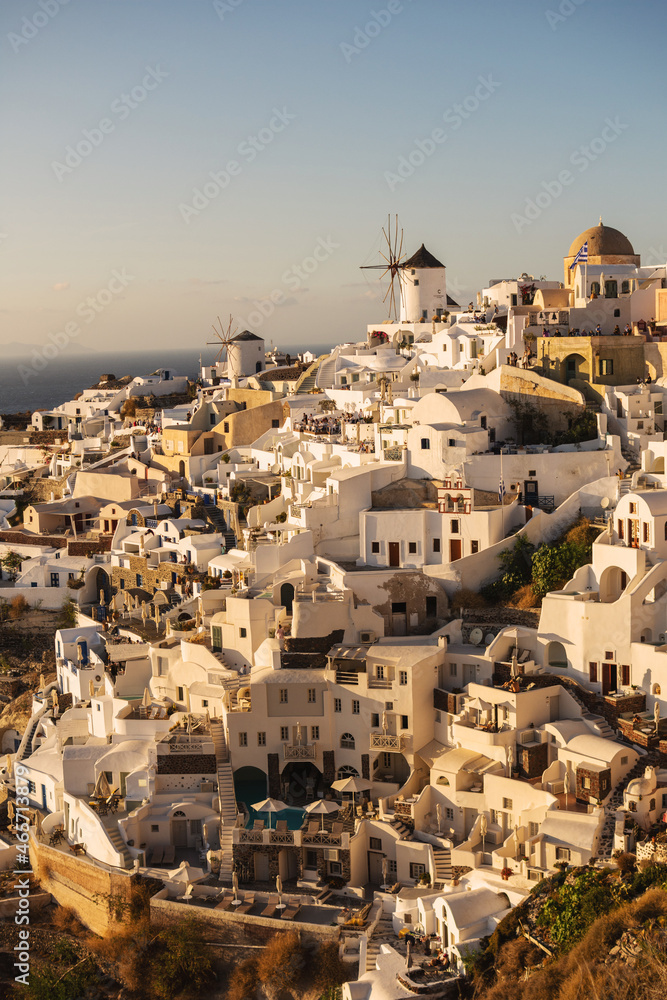 Oia, Greece - October 8, 2021: The village of Oia on Santorini island during sunset