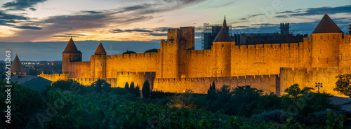 Canvas-taulu Lighted Carcassonne fortification walls seen from vineyards surrounding the city-Panorama