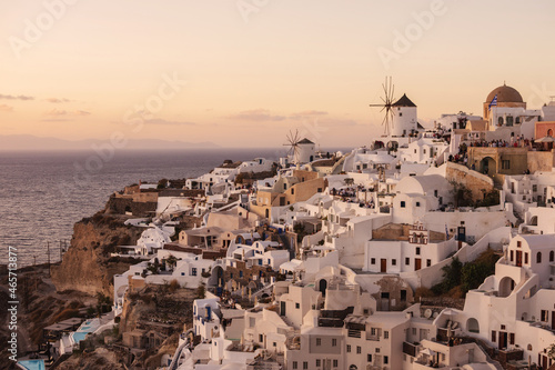 Oia, Greece - October 8, 2021: The village of Oia on Santorini island during sunset