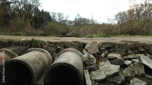 Wallpaper Mural Concrete waste pipes. Streams of water flow through concrete pipes. Polluted body of water in the park. Shooting from the drone. Aerial photography. Torontodigital.ca