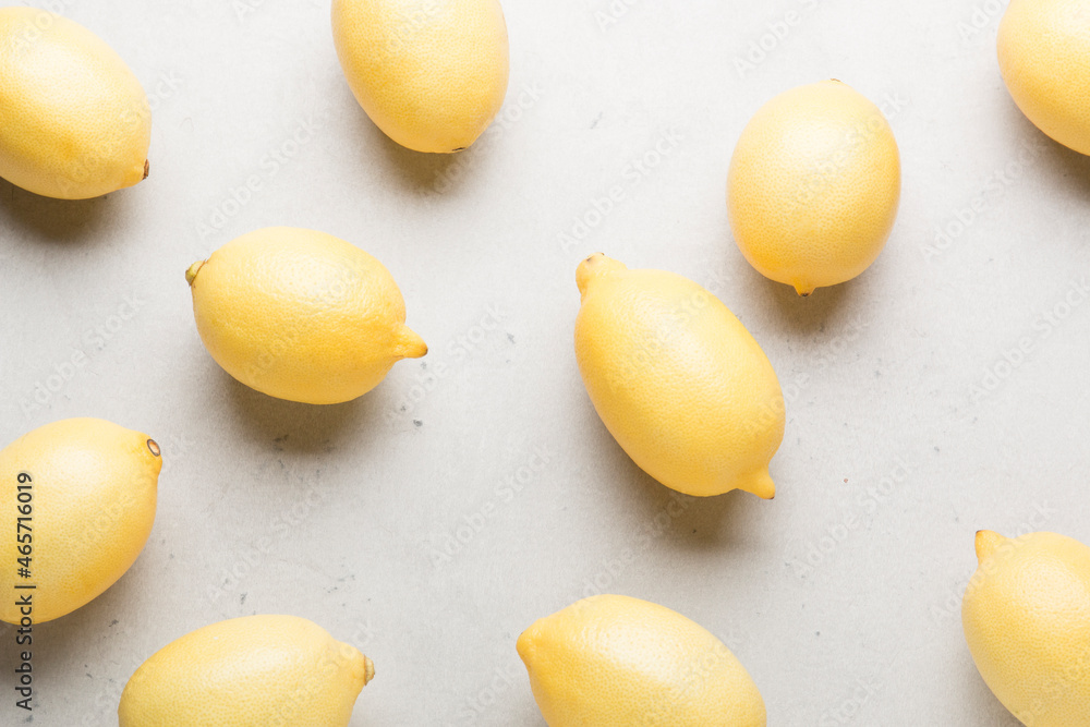 Several yellow bright lemons on a white background. Bright citruses.
